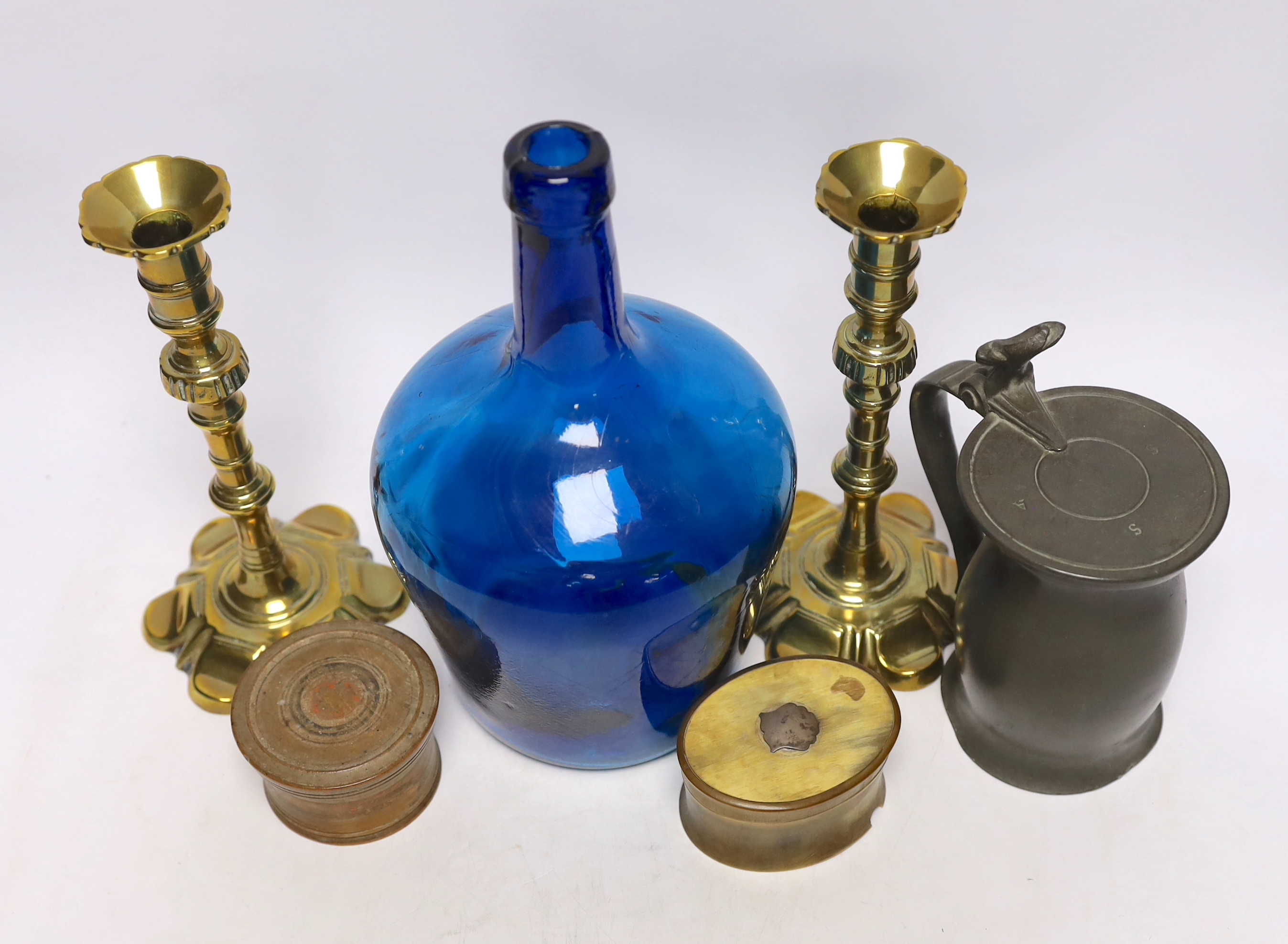 A pair of 18th century brass candlesticks, a blue glass flagon, a horn snuff box, etc. candle sticks 22cm high